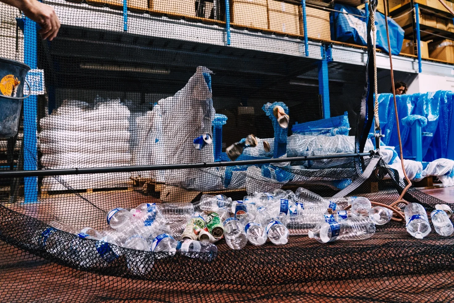 Recovered plastic bottles and waste sorted in the workshop
