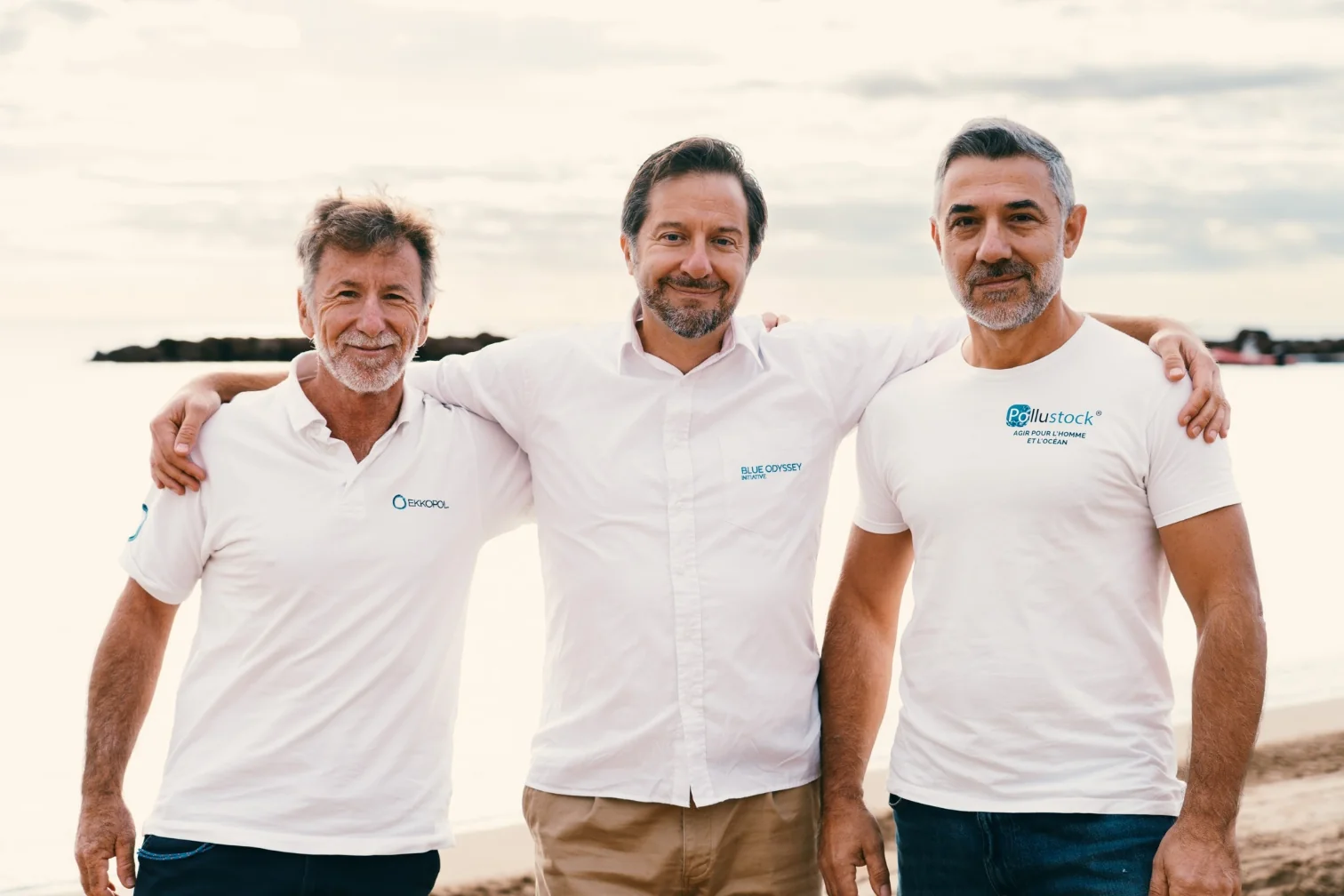 Three members of the PolluSub team on the shore